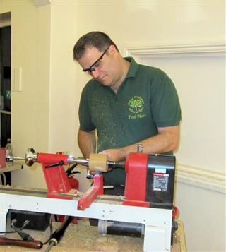 Paul on a small lathe. The big one was being modified to fit him